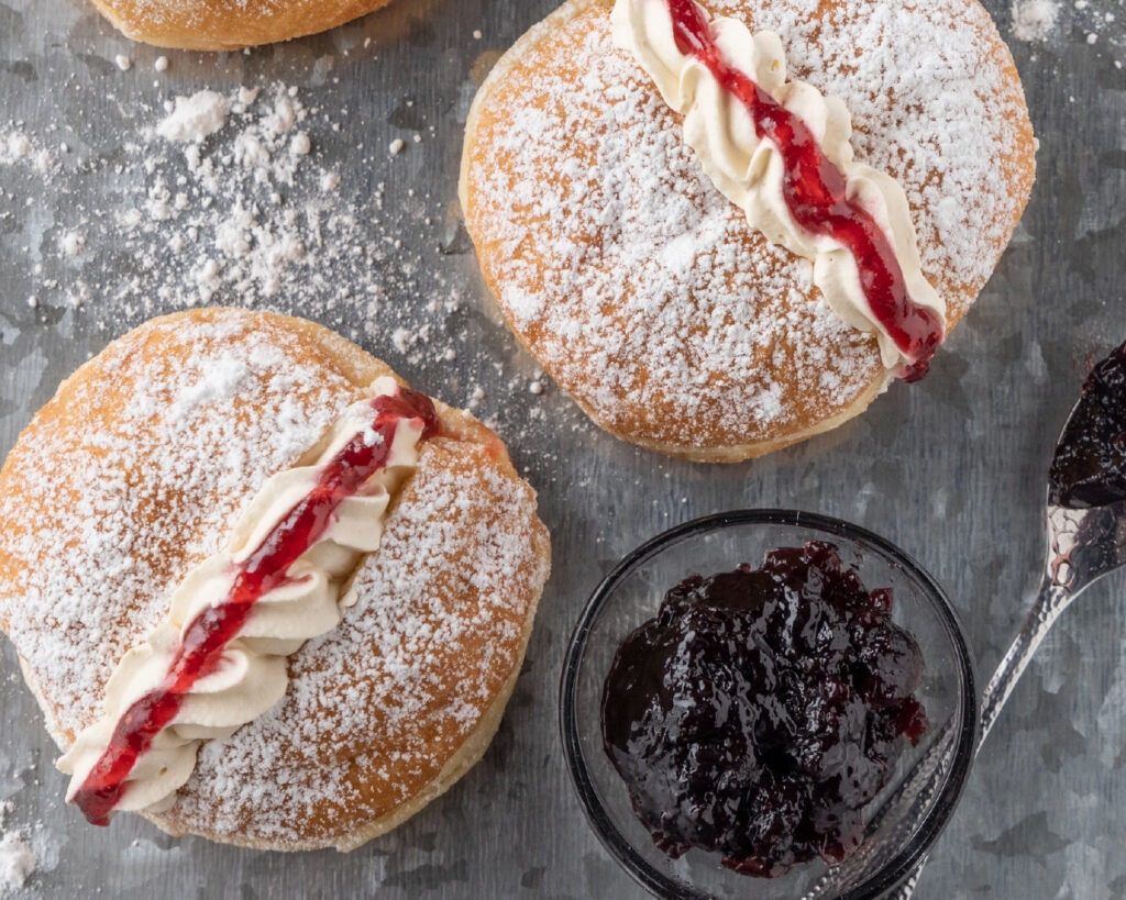 Donut with Raspberry Jam, Creme and Sugar Icing