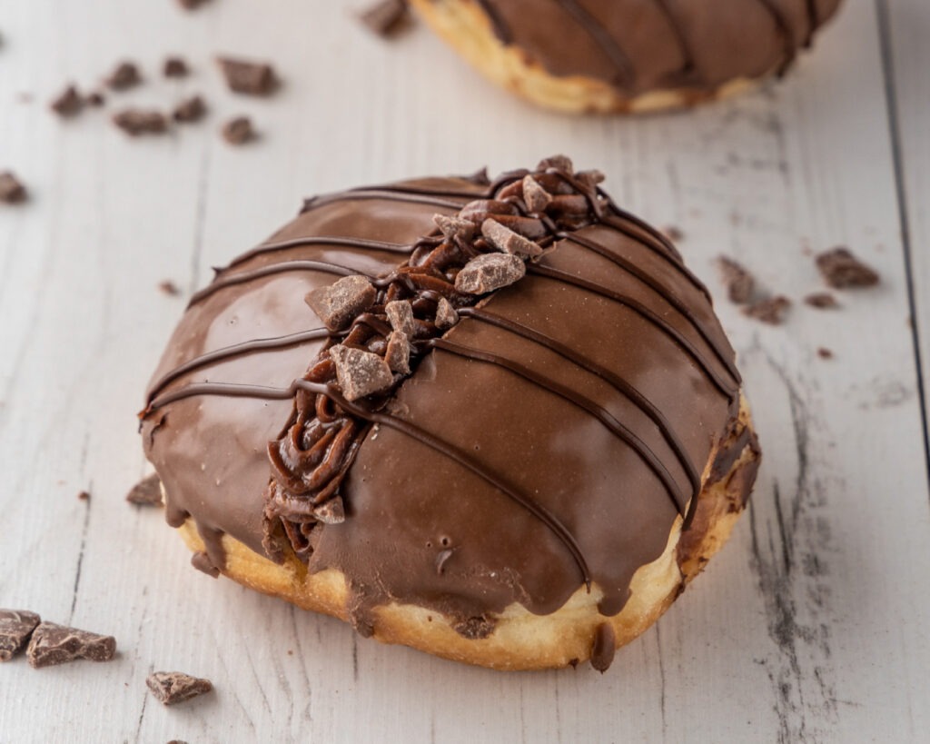 Donut split down the middle, filled with Nutella creme