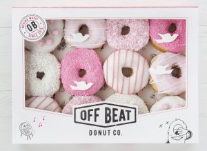 Offbeat Donuts Communion box featuring pink and white donuts with sprinkles and dove decorations